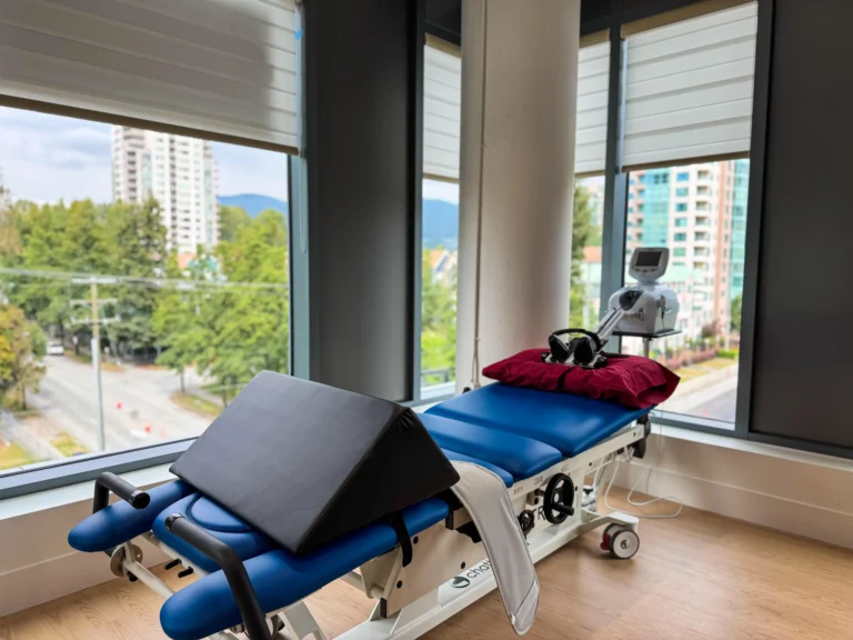 Traction table set up for physical therapy, with adjustable components and cushioning designed for spinal decompression.